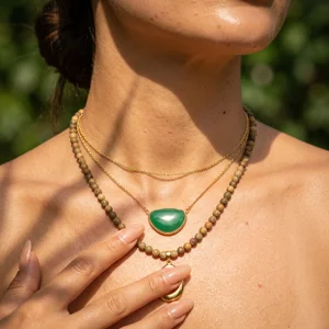 Layered necklaces on sun-kissed skin