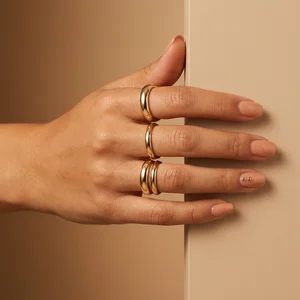 Elegant gold rings and nude nails