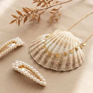 Elegant jewelry on shell and fabric