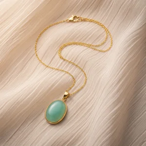 Elegant green stone pendant on silk