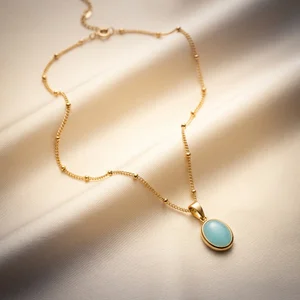 Elegant gold necklace on pleated fabric