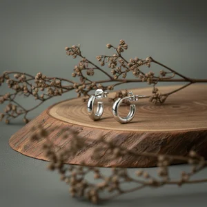 Rustic silver rings on wood