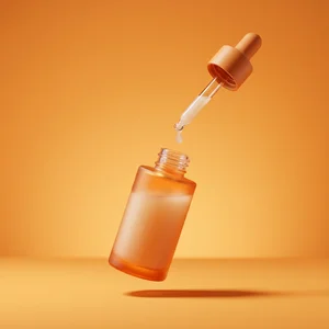 Floating orange serum bottle