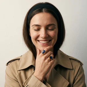 Elegant blue rings on smiling model