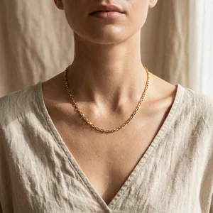 Classic gold link chain necklace on model