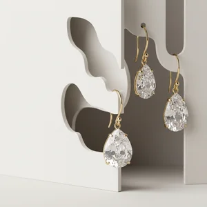 Minimalist crystal earrings on paper