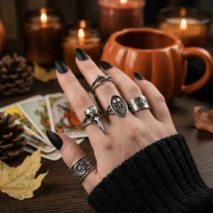 Gothic rings on autumn hand