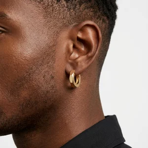 Geometric gold earring on model