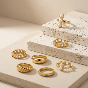 Gold rings on textured stone