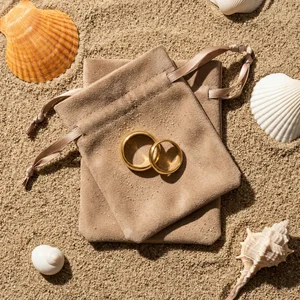 Golden rings on beach sand