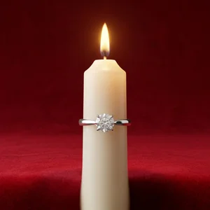 Silver ring on lit candle