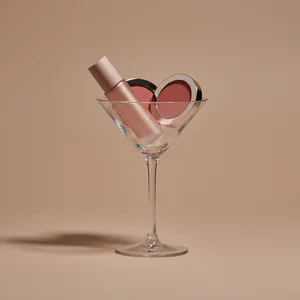 Glamorous cosmetic in martini glass