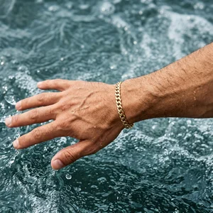 Gold Cuban bracelet in water