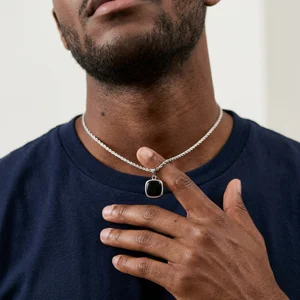 Men's silver necklace on model