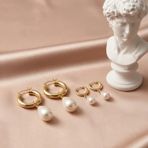 Elegant pearl earrings on satin