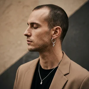 Minimalist men's jewelry on model