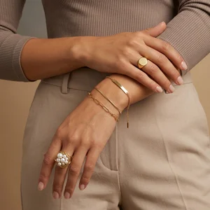 Elegant gold jewelry on hands