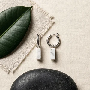 Minimalist marble earrings flat-lay