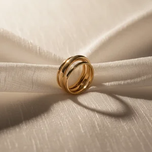 Stacked Gold Rings on Fabric