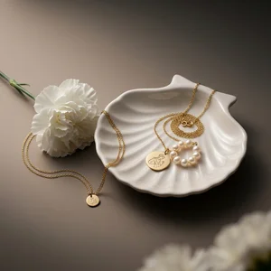 Elegant gold jewelry in shell dish