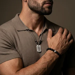 Modern man wearing a necklace and bracelet