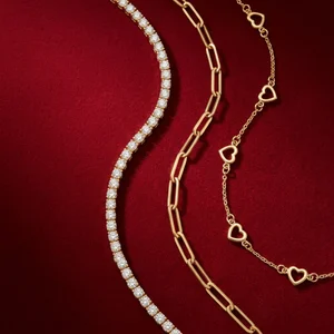 Luxury gold necklaces on red