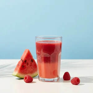 Fresh watermelon smoothie with palm shadow