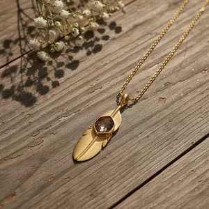 Feather Necklace on Wood