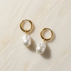 Baroque pearl earrings on marble