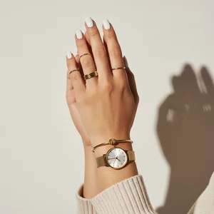 Stylish hand with watch and rings