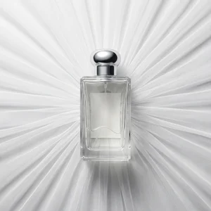 Elegant perfume on white tulle