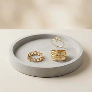 Minimalist gold rings on concrete