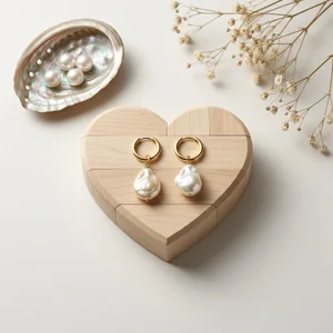 Pearl earrings on heart wood