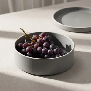 Minimalist grey bowl with grapes