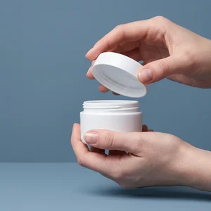 Opening cosmetic jar in hands