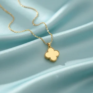 Delicate gold clover necklace