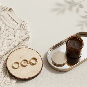 Cozy flat-lay with candle and rings