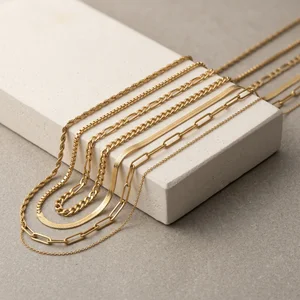Layered gold chains on stone block
