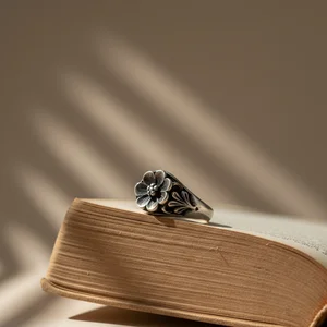 Engagement ring on book