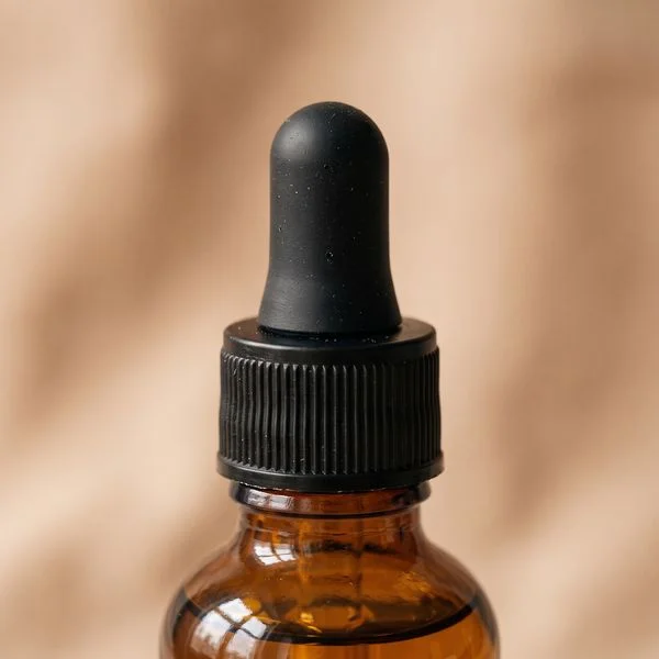 Macro detail reference view of the serum bottle's dropper