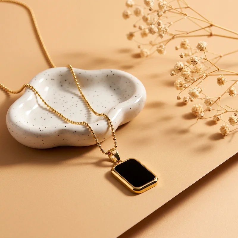 Elegant gold necklace on ceramic