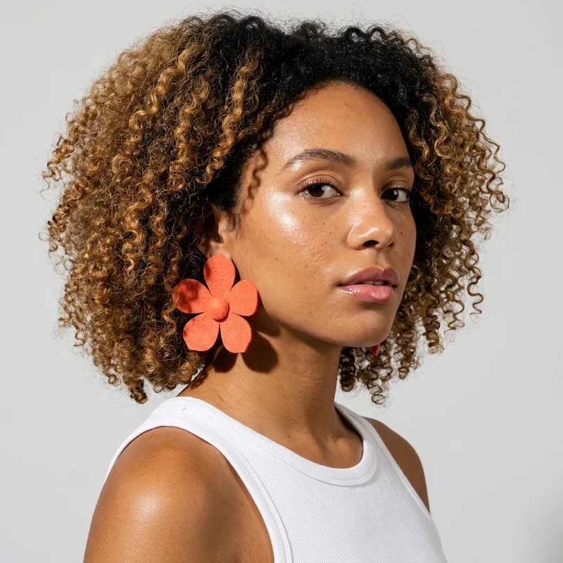 Model showcasing floral earrings