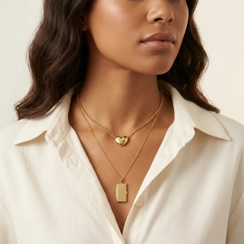 Layered gold necklaces on model