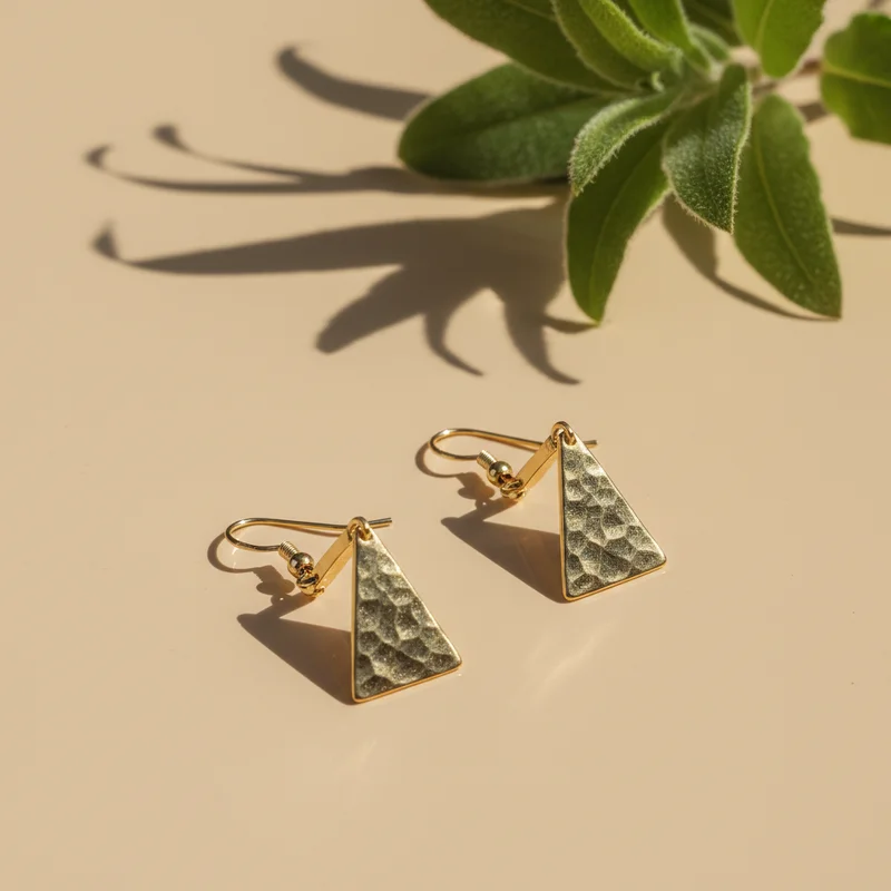Artisan hammered golden earrings