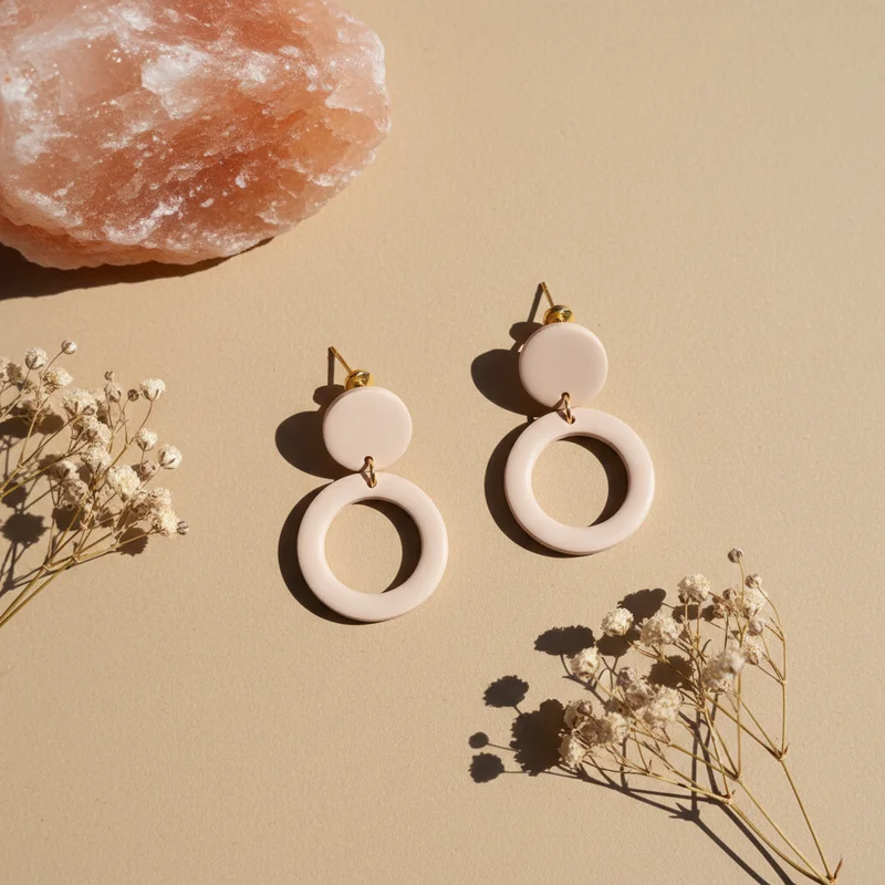 Luxury gold earrings on marble