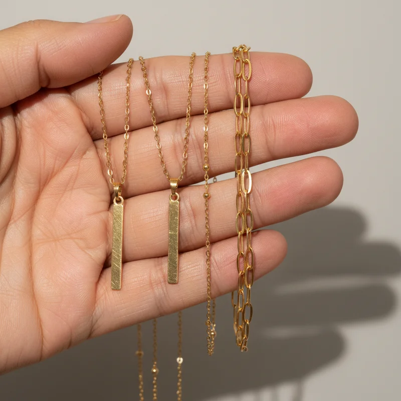 Delicate gold jewelry held