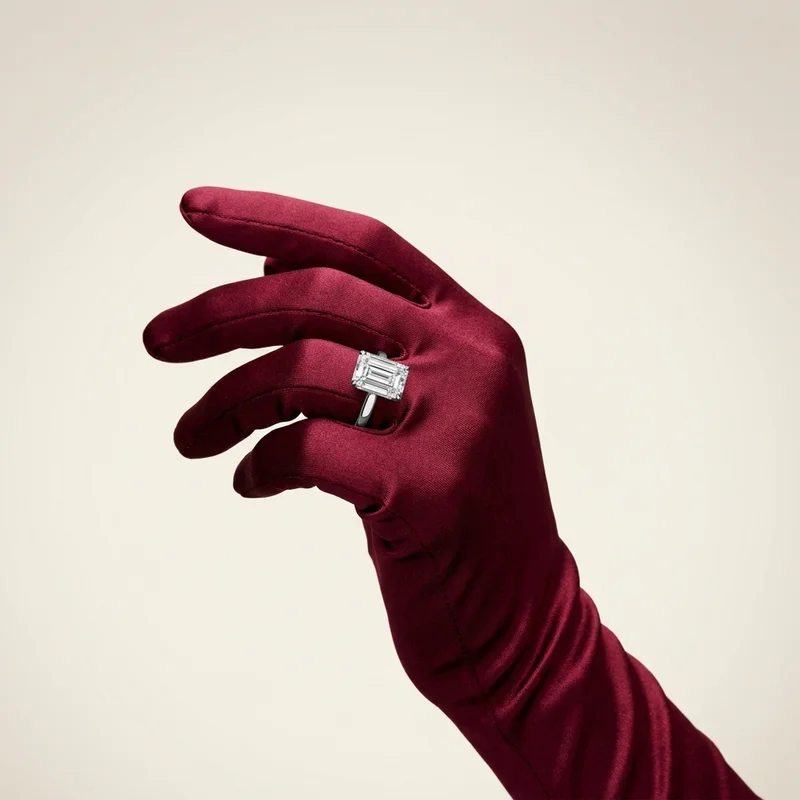 Diamond ring on burgundy satin glove