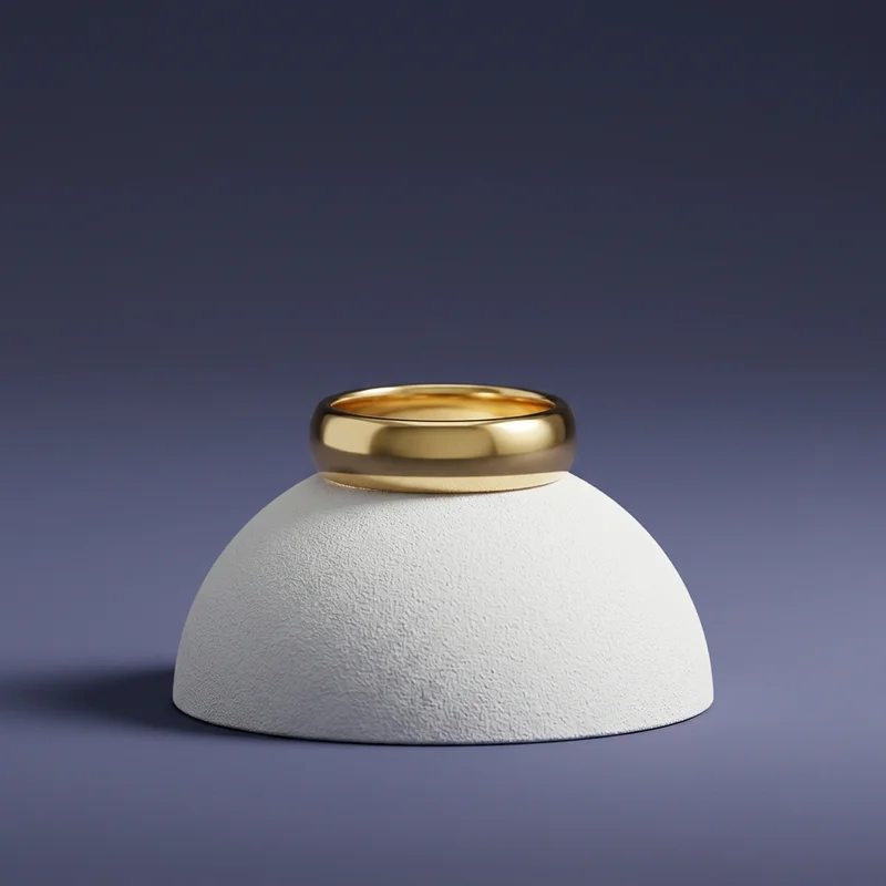 Gold ring on concrete pedestal