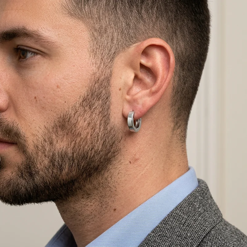 Men's silver hoop earring on model