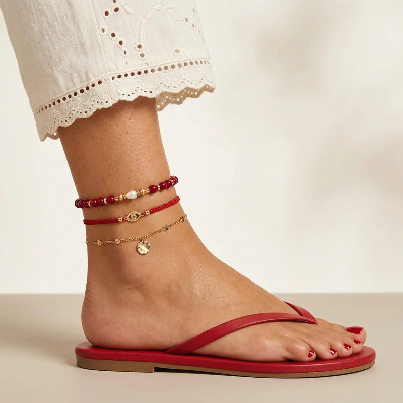 Layered anklets on summer foot